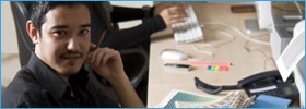 Student sitting by computer