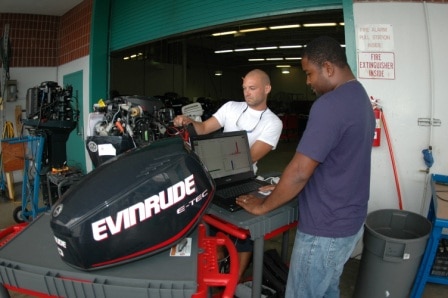 Students working on a boat motor