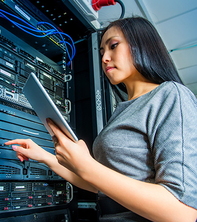 female IT tech in server room