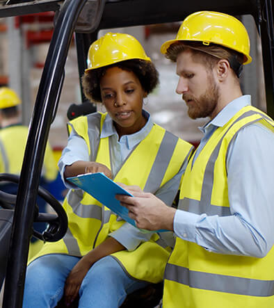 forklift driver talking to w a co-worker