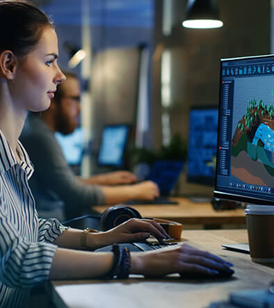 woman at computer creating animations or gaming