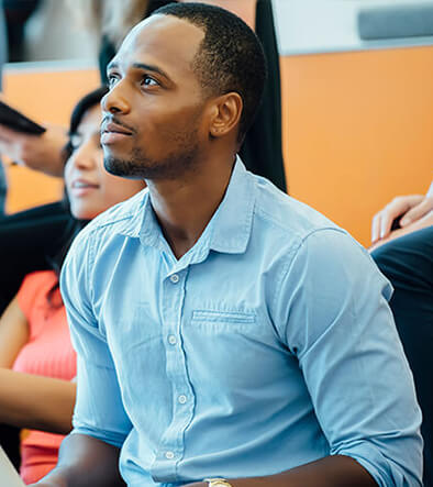 young man in adult basic education test