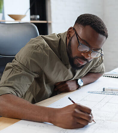 drafting professional working on building plans