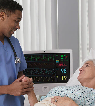 Electrocardiograph Technician talking with a patient